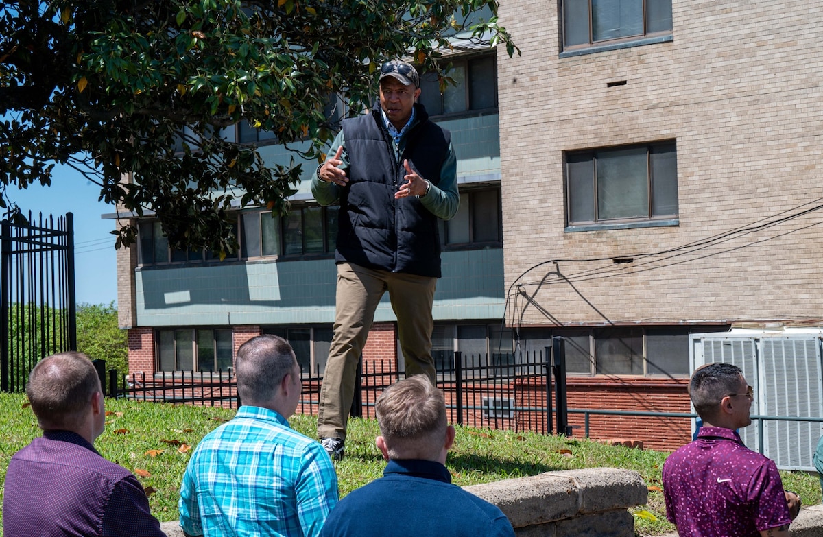 U.S. Air Force Maj. Thomas Simmons, staff chaplain and course director for the Chaplain Spiritual Leadership Course, addresses the group on the beginning of an exercise walk in downtown Montgomery, Alabama, April 9, 2025.