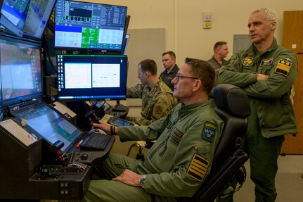 Swedish air force Col. Jonas Nellsjo, the assistant air attache for Canada and the United States, pilots an MQ-9 Reaper simulator during a visit to Hancock Field Air National Guard Base in Syracuse, NY, Apr. 7.