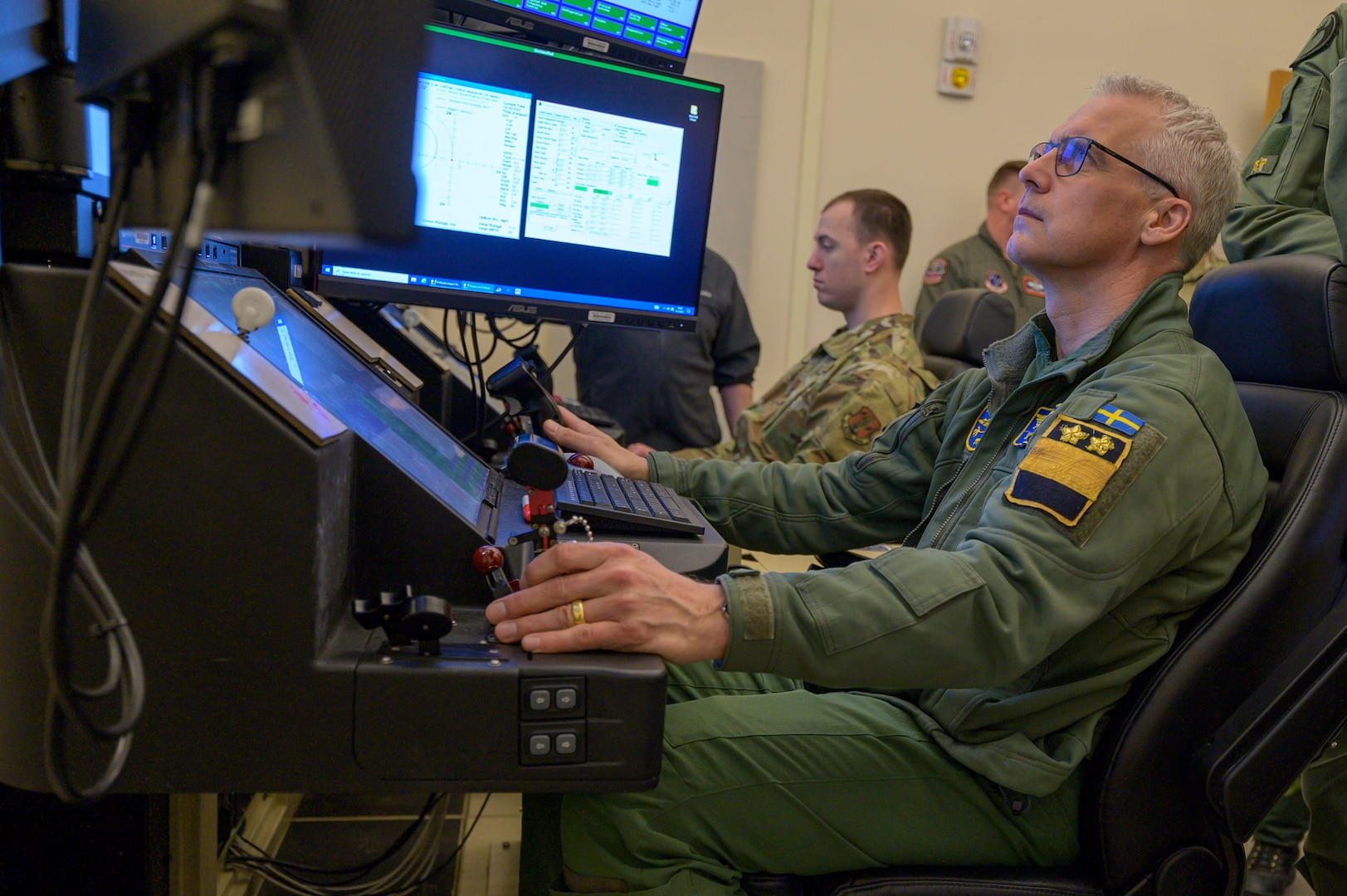 Swedish air force Maj. Gen. Jonas Wikman, chief of the Swedish air force, pilots an MQ-9 Reaper simulator during a visit to Hancock Field Air National Guard Base in Syracuse, NY, Apr. 7.