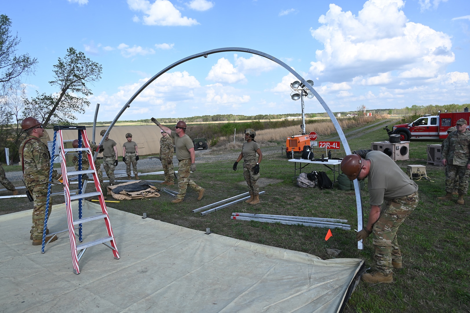Airmen assigned to the 175th Wing, Maryland Air National Guard, construct a small shelter system at the 145th Regional Training Site in Badin, North Carolina, April 4, 2025.