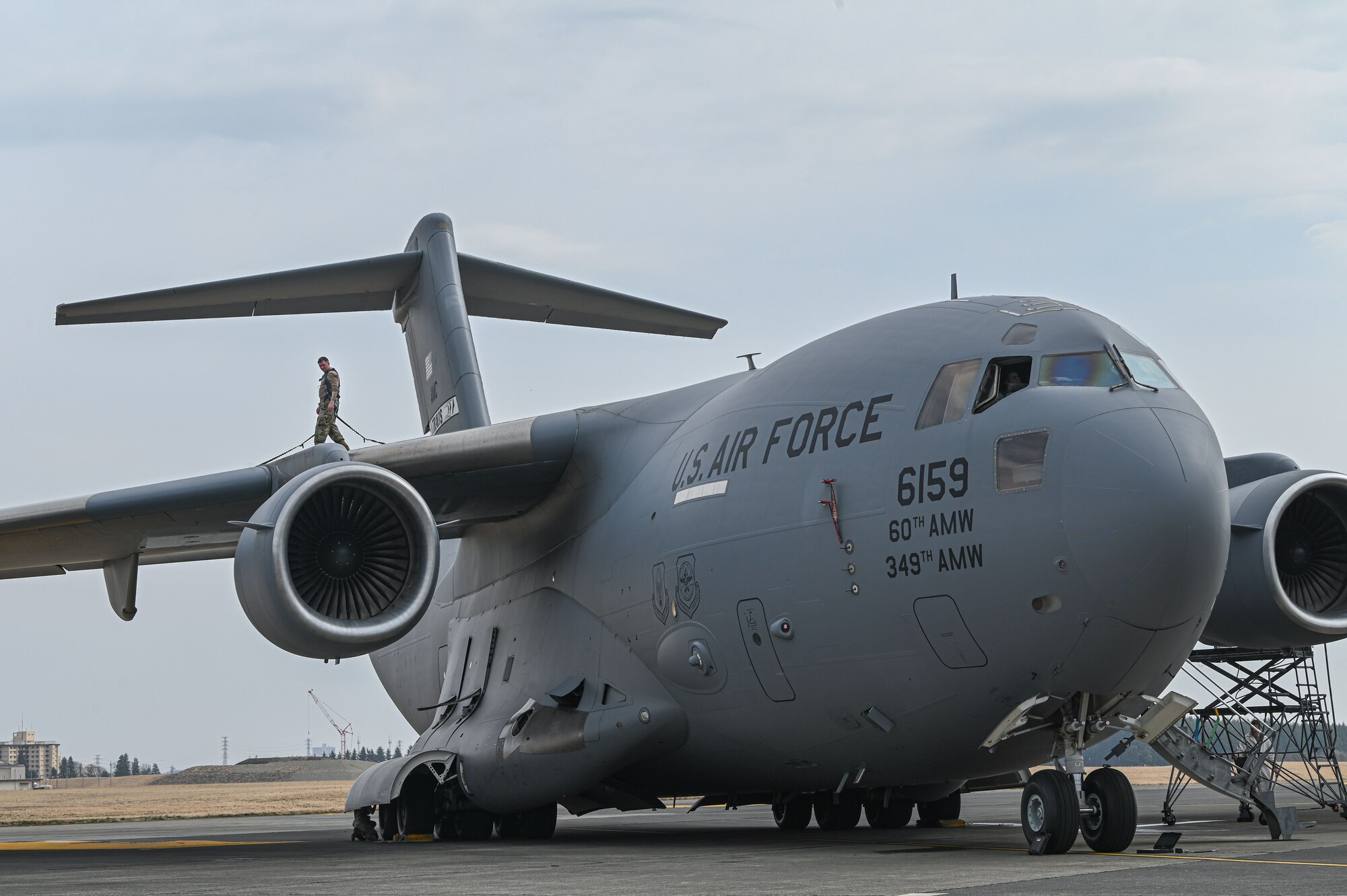 Airman walks on aircraft