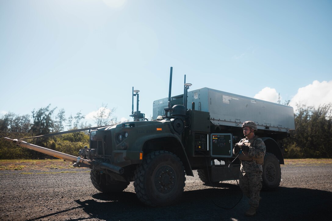 U.S. Marine Corps Pfc. Christian Renklema, a native of Georgia and an artillery cannoneer with 3d Littoral Combat Team, 3d Marine Littoral Regiment, 3d Marine Division, operates the Navy Marine Expeditionary Ship Interdiction System on Marine Corps Training Area Bellows, Hawaii, Oct. 24, 2024. The NMESIS provides the Marine Corps a highly deployable, land-based, anti-ship system that is a key capability for the Marine Littoral Regiment. (U.S. Marine Corps photo by Cpl. Eric Huynh)