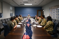 Chief Nuñez sits with Airmen