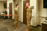 Airman salutes Lt Gen John Healy
