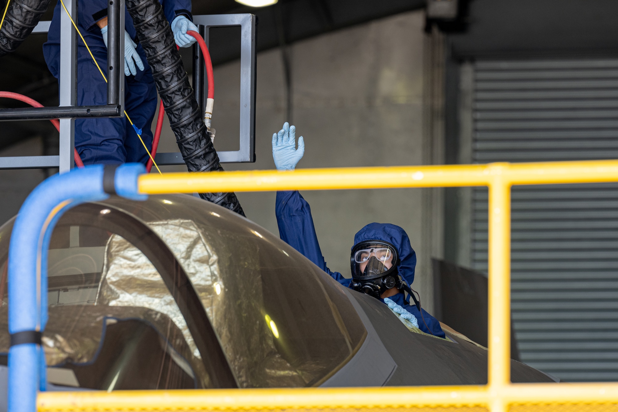 An Airman enters an aircraft fuselage