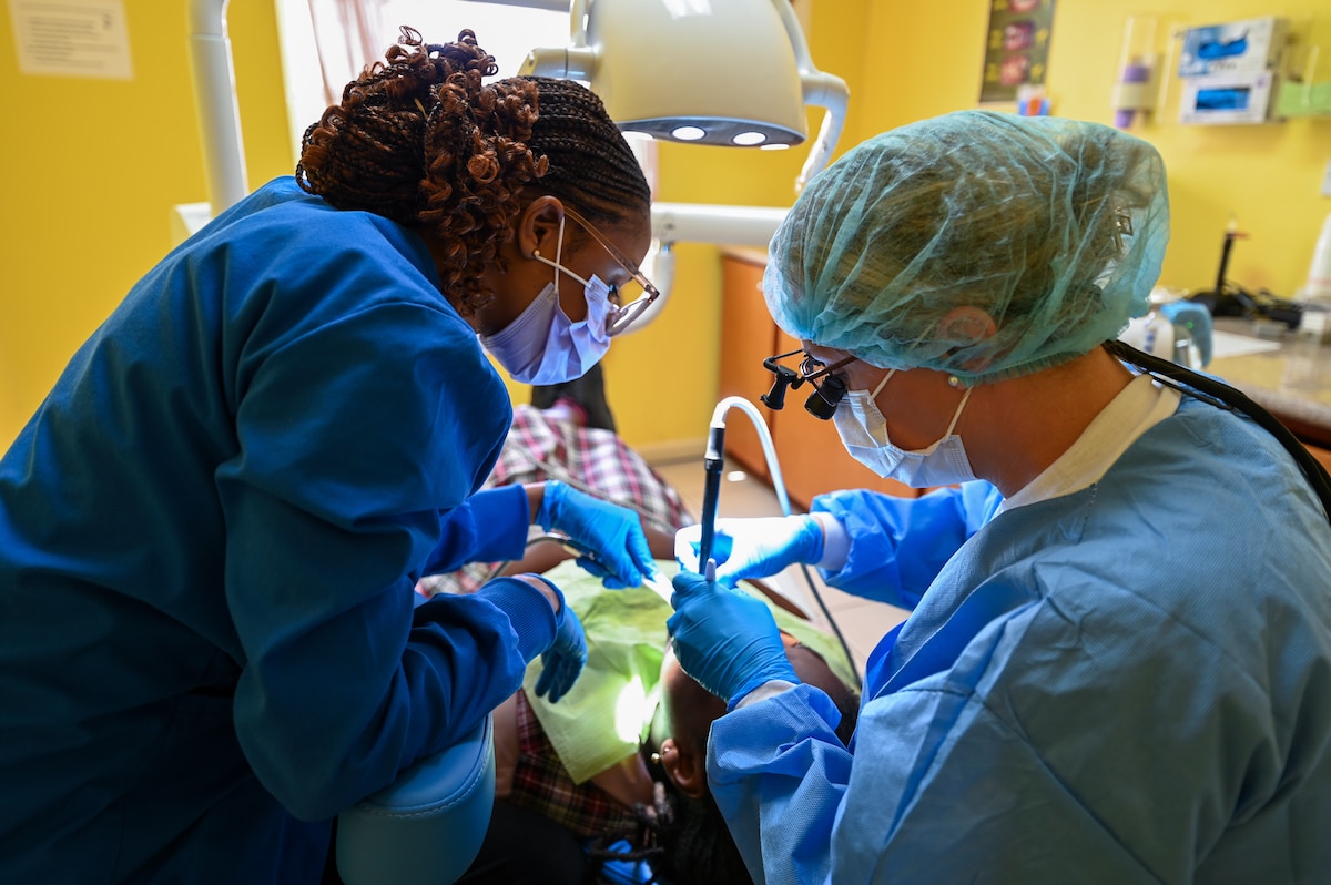 U.S. Air Force Lt. Col. Jessica Harvey, a 433rd Medical Squadron dentist, works alongside a St. Kitts and Nevis dental assistant to treat a local patient at the Newtown Dental Clinic in St. Kitts and Nevis, March 24, 2025.