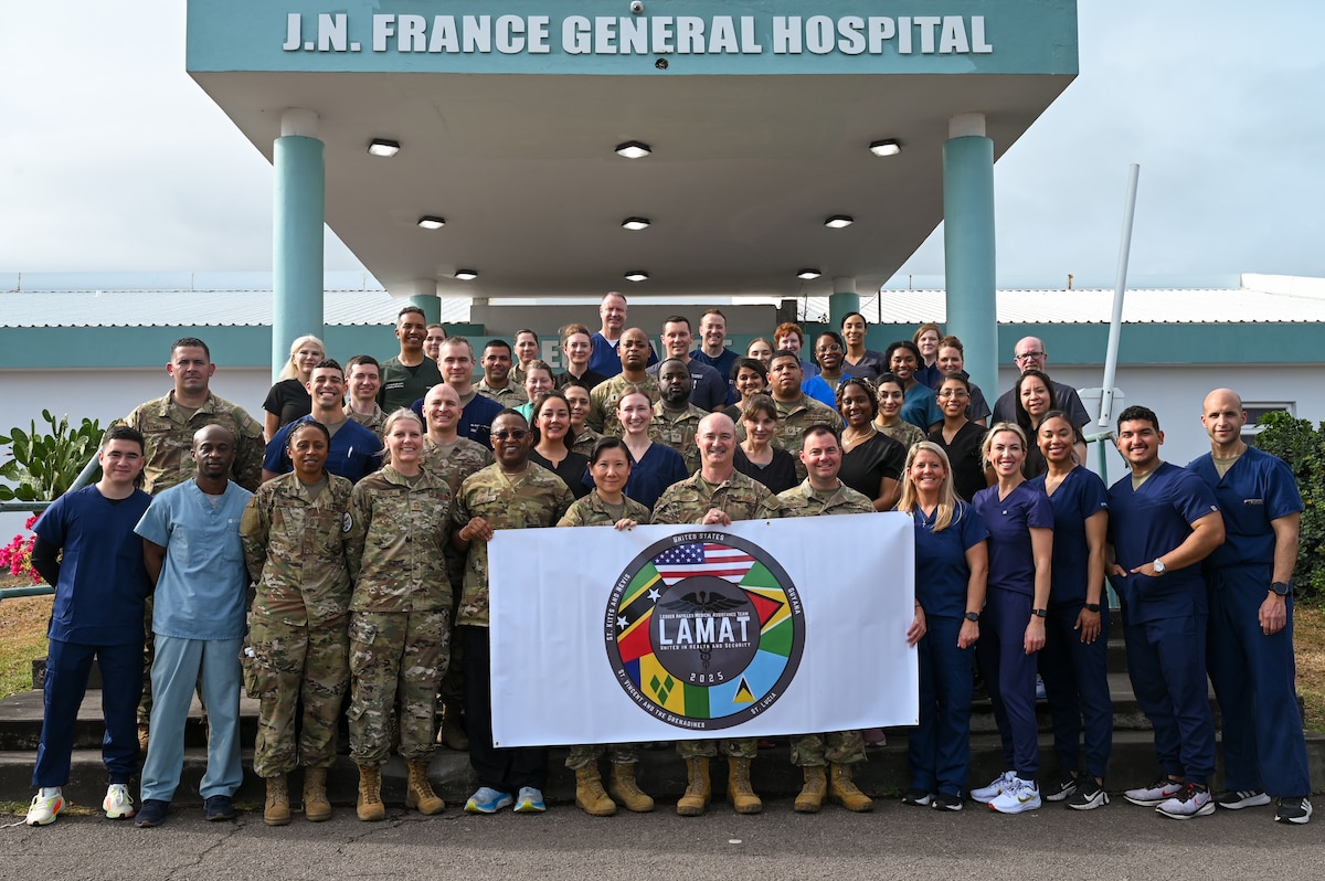 U.S. Air Force members participating in the Lesser Antilles Medical Assistance Team (LAMAT) 2025 mission pose for a group photo outside of Joseph N. France (JNF) General Hospital in Basseterre, St. Kitts and Nevis, March 25, 2025.