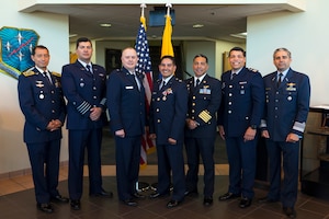 U.S. Air Force Brig. Gen. John Creel, Air Forces Southern deputy commander, center-left, poses for a group photo with Air Forces Southern foreign liaison officers at Davis-Monthan Air Force Base, Arizona, March 25, 2025. Foreign liaison officers serve as vital conduits between partner nations and U.S. military organizations, helping foster trust, enhance interoperability and coordinate joint efforts in pursuit of shared defense goals. (U.S. Air Force Photo by Tech. Sgt. Rachel Maxwell)