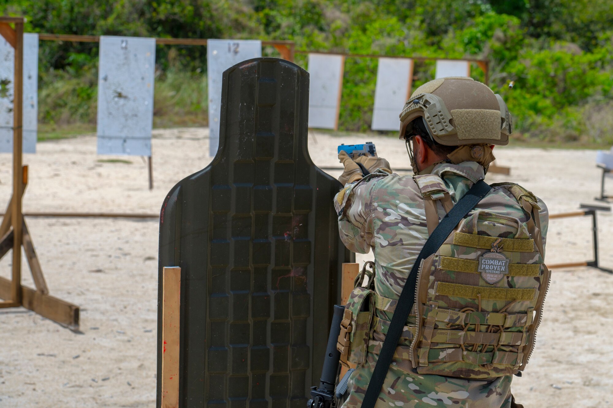 A U.S. Air Force 36th Security Forces Squadron team member takes cover during training at Andersen Air Force Base, Guam, April 15, 2025. The training was held to hone communication and combat arms skills. (U.S. Air Force photo by Airman 1st Class Joseph Maye)