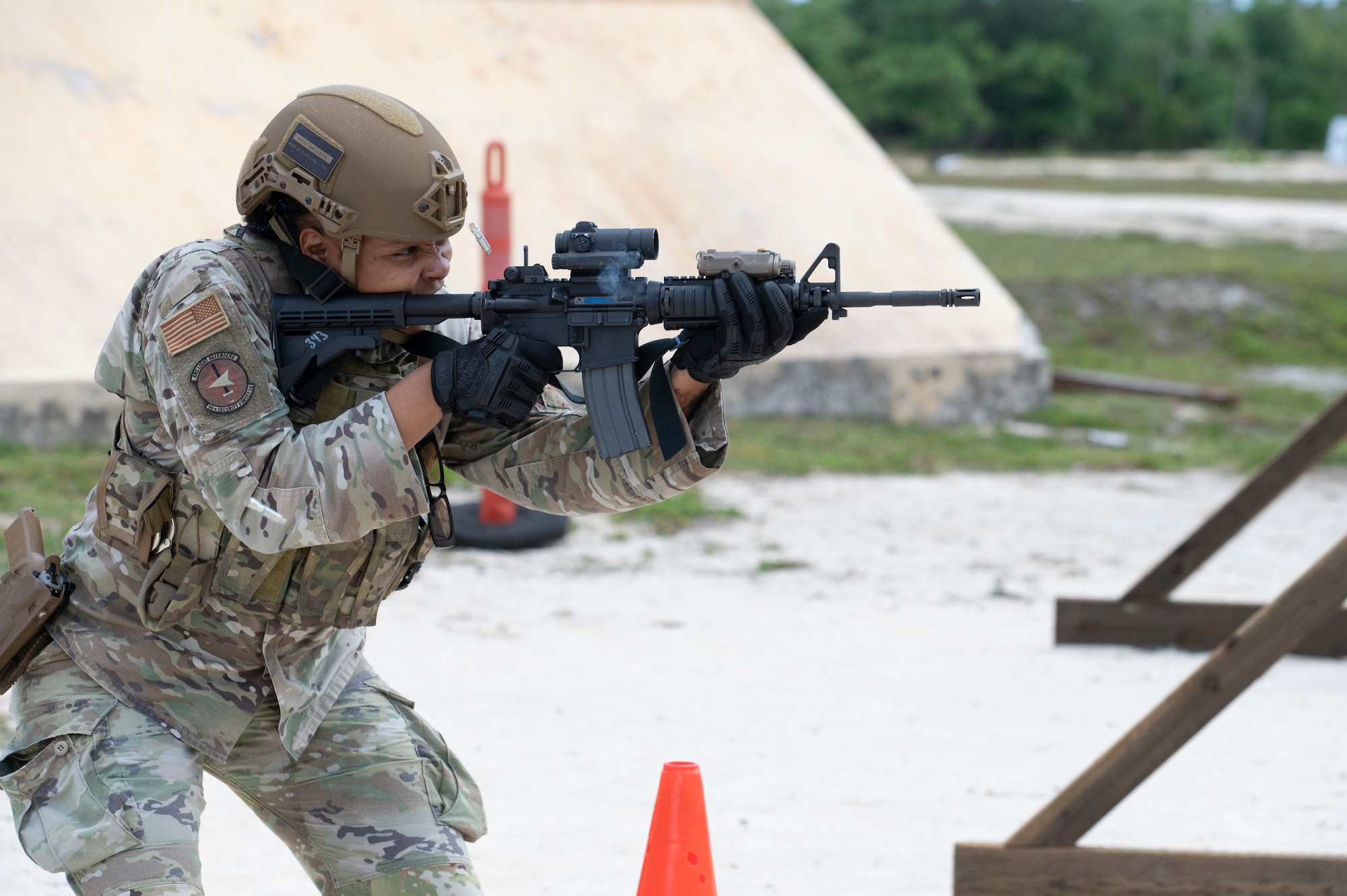 U.S. Air Force Senior Airman Deondrea Esperon, 36th Security Forces Squadron military working dog handler, fires shots on a target during training on Andersen Air Force Base, Guam, April 15, 2025. The training was called “Shoot Move Communicate”, which emphasizes the importance of adaptability and communication when on the field. (U.S. Air Force photo by Airman 1st Class Joseph Maye)