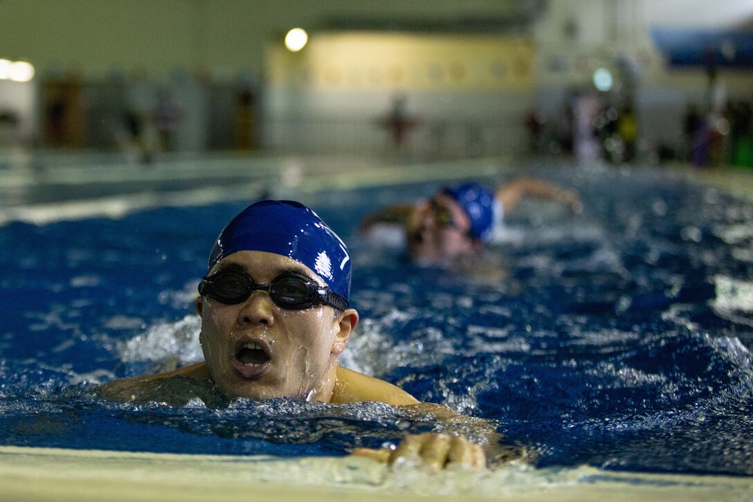 Participants in the 36th Marine Corps Air Station Iwakuni Sprint Triathlon compete in the swimming portion of the event MCAS Iwakuni, Japan, April. 13, 2025. The triathlon included a 350-meter swim, 12-kilometer bike ride, and 4.5-kilometer run, and was held to strengthen relationships between U.S. and Japanese personnel through friendly competition. (U.S. Marine Corps photo by Sgt. Isaac Orozco)