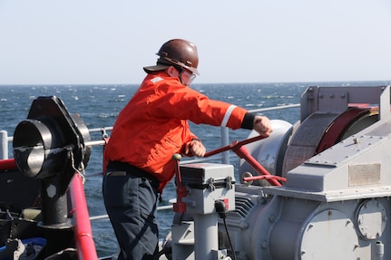 AT SEA (April 8, 2025) Mineman 2nd Class Dylan Berney, from Burlington, Kentucky, and assigned to the Avenger-class mine countermeasures ship USS Warrior (MCM 10), engages the anchor windlass brake hand wheel during an anchoring evolution during Korean Spring Exercise (KSE) at sea, April 8, 2025. Korean Spring Exercise increases combined proficiency between the Republic of Korea Navy and the U.S. Navy through the exchange of tactics and techniques, while enhancing common bonds. KSE takes place in U.S. 7th Fleet, the U.S. Navy’s largest forward-deployed numbered fleet, which routinely interacts and operates with allies and partners in preserving a free and open Indo-Pacific region. (U.S. Navy photo by Mineman 1st Class Michael Phillips)