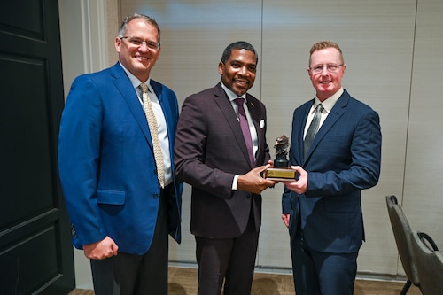 U.S. Air Force Maj. Gen. Frank Bradfield III, Air Force Reserve Command deputy commander, and Col. James “Matt” Bershinsky, 433rd Medical Group commander, pose for a photo with the Honorable Dr. Terrance M. Drew, Prime Minister of St. Kitts and Nevis, following the closing ceremony for the St. Kitts and Nevis phase of the Lesser Antilles Medical Assistance Team (LAMAT) 2025 mission April 4, 2025.