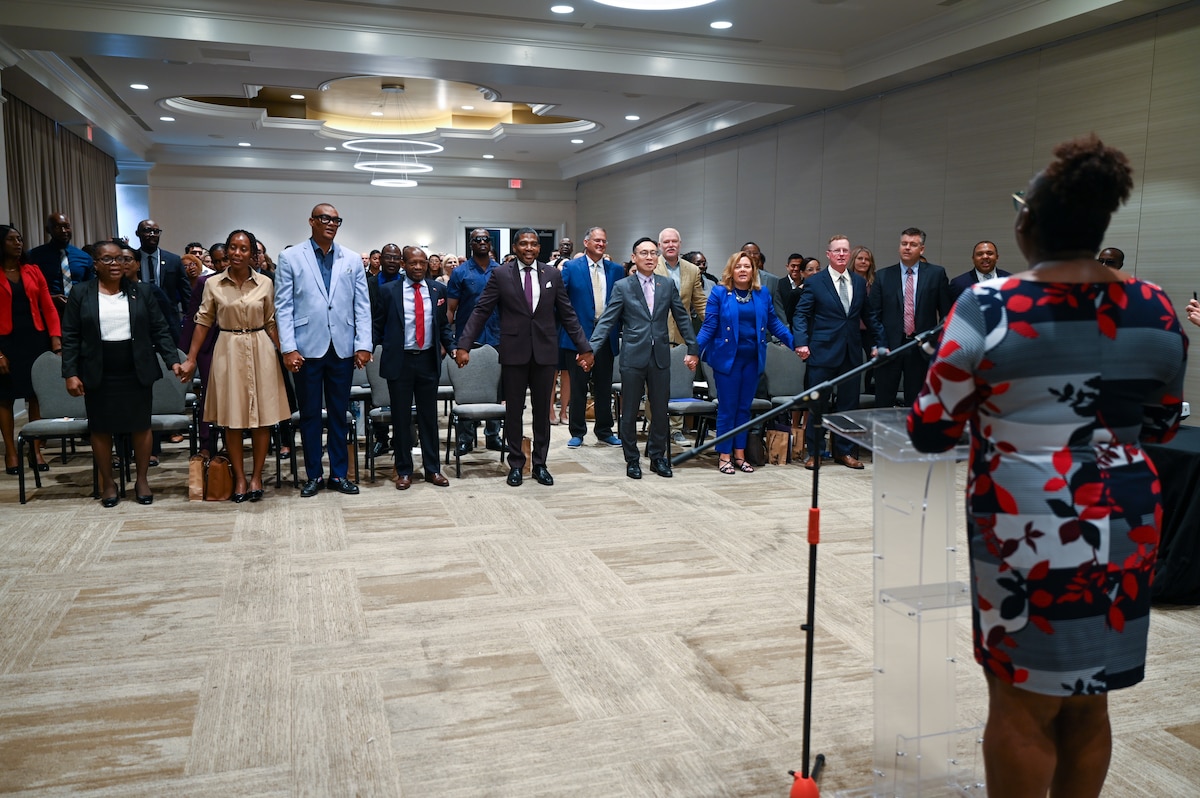 Representatives of all the partner nations participating in the St. Kitts and Nevis phase of the Lesser Antilles Medical Assistance Team (LAMAT) 2025 mission hold hands during the singing of “Heal the World” as part of the closing ceremony for this phase April 4, 2025.