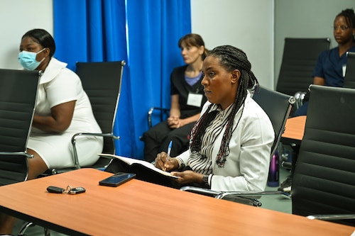 Dr. Natalie Osborne, a Kittitian general surgeon, and other medical professionals  listen to a lecture about traumatic brain injuries at Joseph N. France General Hospital in Basseterre, St. Kitts and Nevis, April 1, 2025.