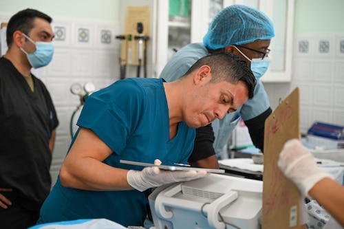 U.S. Air Force Senior Airman Roman Calloway, 433rd Medical Squadron medical technician, works with other Air Force medical professionals to treat a three-month-old infant in the emergency room at Alexandria Hospital in St. Kitts and Nevis, March 28, 2025.