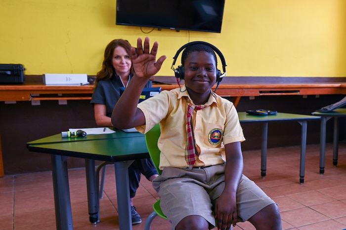 Dr. Heather Jensen (left), a Non-Government Organization (NGO) audiologist, conducts a hearing test on an 11-year-old Kittitian boy at the Halliday-Smith Primary School in Basseterre, St. Kitts and Nevis March 26, 2025.