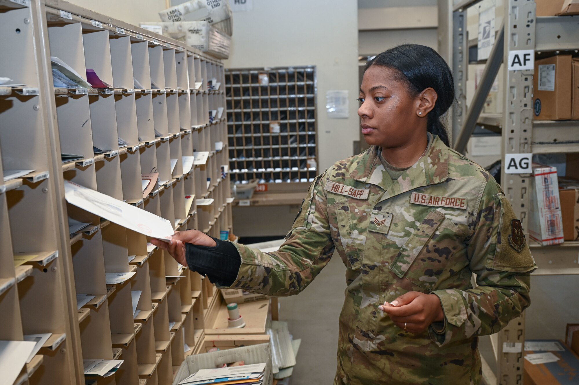 Airman sorts mail