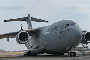 Airman walks on aircraft