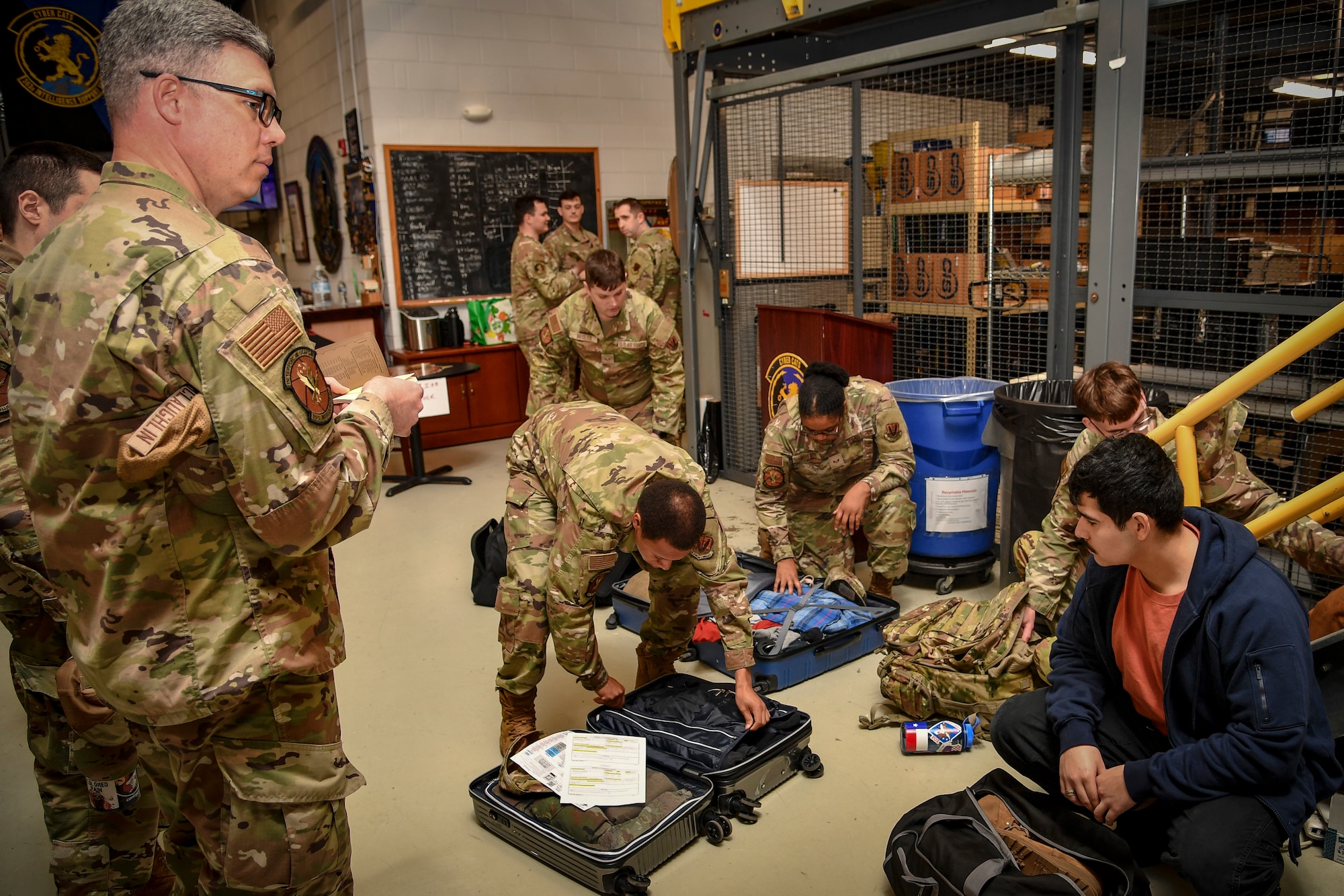 An Air Force members shows the items in his packed luggage.