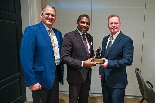 U.S. Air Force Maj. Gen. Frank Bradfield III, Air Force Reserve Command deputy commander, and Col. James “Matt” Bershinsky, 433rd Medical Group commander, pose for a photo with the Honorable Dr. Terrance M. Drew, Prime Minister of St. Kitts and Nevis, following the closing ceremony for the St. Kitts and Nevis phase of the Lesser Antilles Medical Assistance Team (LAMAT) 2025 mission April 4, 2025.