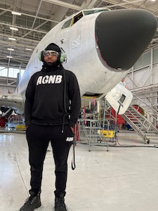 Man standing in front of airplane