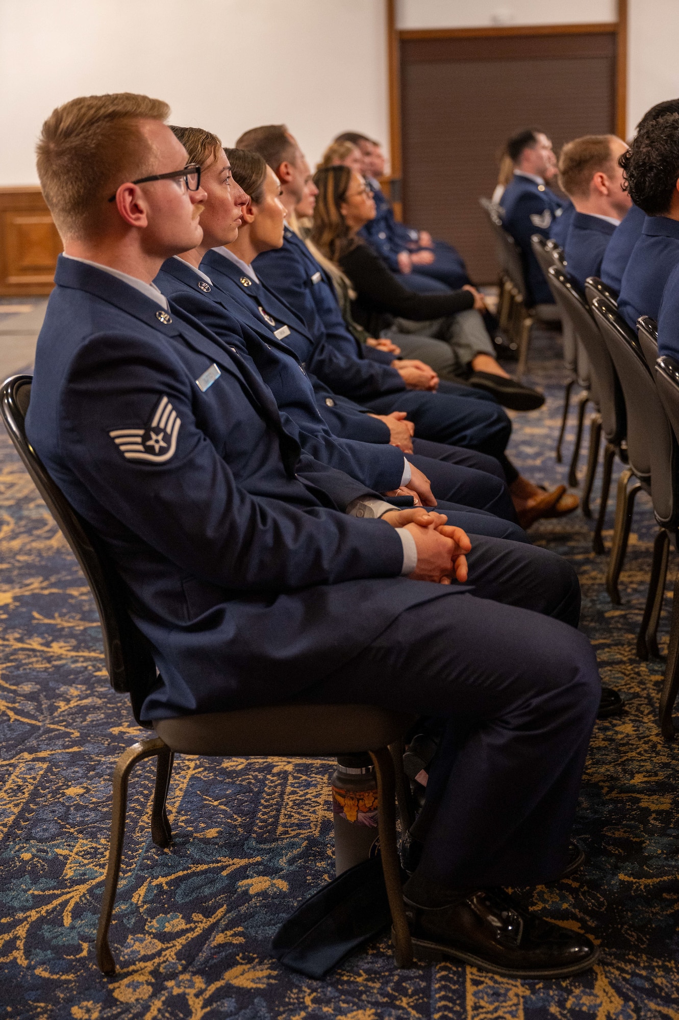 U.S. Airmen and civilians attend the remembrance ceremony honoring the fallen crew of Implementation Force-21 at Ramstein Air Base, Germany, April 10, 2025. Following the ceremony, members of the 76th Airlift Squadron will fly to Dubrovnik, Croatia and hike over six miles to visit the memorial site and pay their respects to their lost family members.