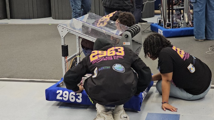 Students from Anacostia High School inspect their robot, “Anadroid 2963,” before entering their trial run at the For Inspiration and Recognition of Science and Technology Chesapeake competition in Alexandria, Va., on March 23, 2025. Strategic Systems Programs (SSP) General Engineer Ishmael Kamara served as a first-mentor to the school’s robotics team and assisted students in everything from assembly to answering thought-provoking questions from STEM judges. SSP is the U.S. Navy’s technical expert in maintaining and developing the nation’s most survivable leg of the nuclear triad, which consists of the current Trident D5LE missiles on the Ohio-class ballistic missile submarines.