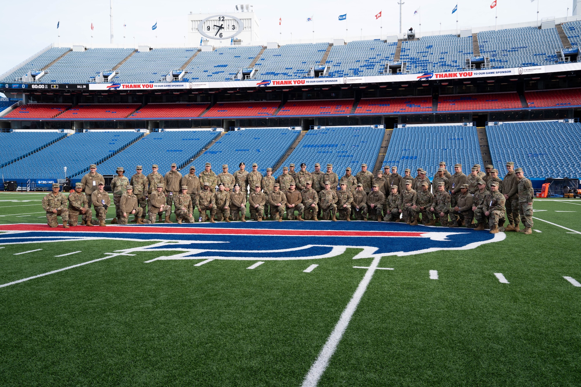 Members assigned to the 914th Air Refueling Wing, 107th Attack Wing, Buffalo MEPS and the 2nd Squadron, 101st Cavalry, pose for a photo following a salute to service ceremony rehearsal at Highmark Stadium, Orchard Park, N.Y. on Nov. 21, 2021. The football game hosted by the Buffalo Bills was designated as a salute to service game to honor active members of the U.S. Military and it's veterans. U.S. Air National Guard photo by Senior Airman Michael Janker.