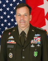 Soldier in front of flags