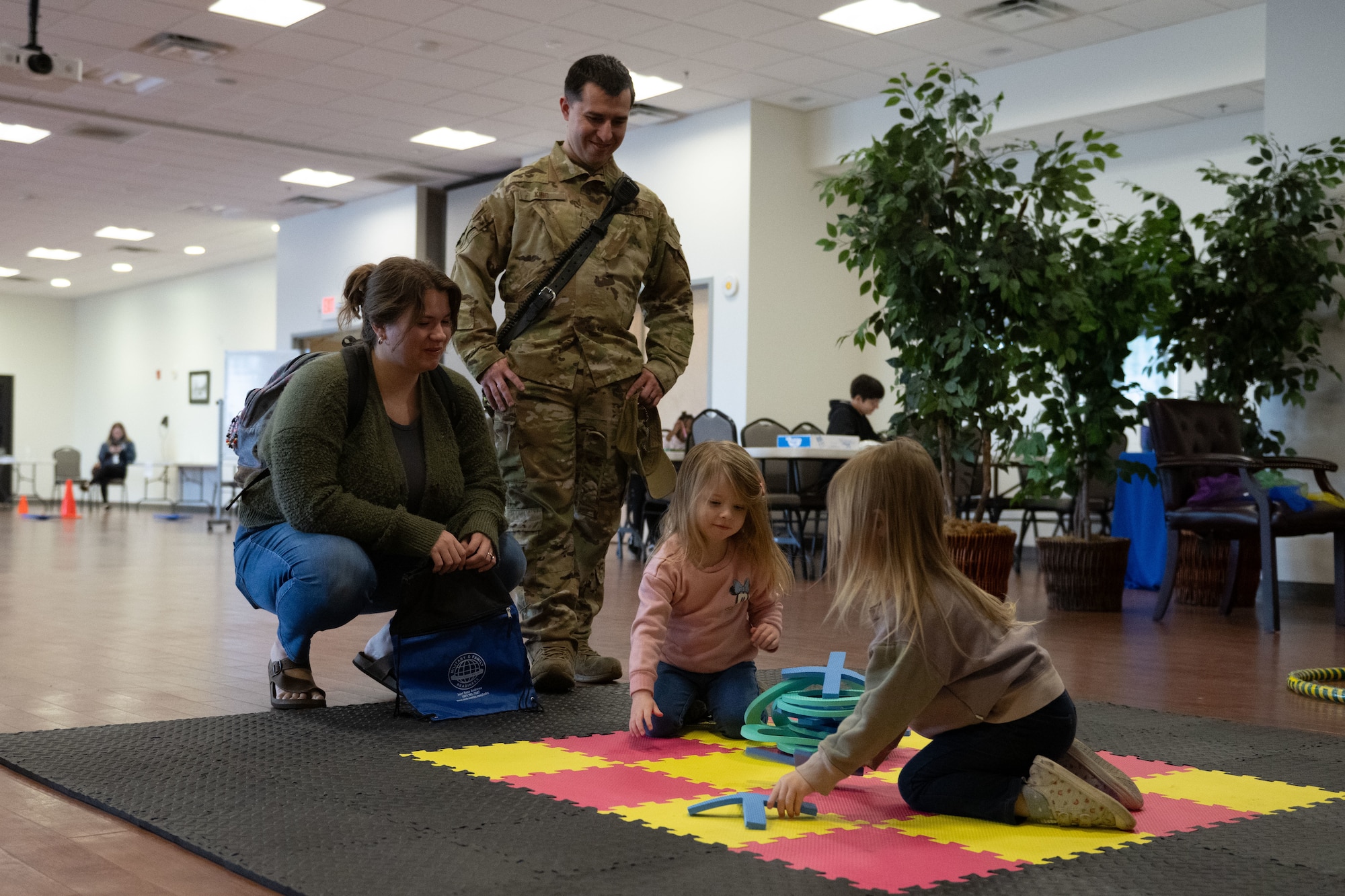Kids play while parents watch during Adaptive Field Day.