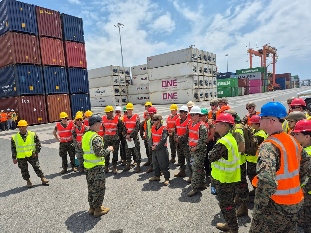 A technical advisory and assistance team from Blount Island Command and Marines from 3rd Marine Division prepare for pier-side offloading from the USNS Sisler, a cargo ship operated by Military Sealift Command, March 24 at Subic Bay in the Philippines. Equipment, sent from Marine Corps Support Facility Blount Island in Jacksonville, Florida, the hub of Marine Corps’ prepositioning programs, will support Marines participating in Exercise Balikatan 25, which kicks off April 21. Balikatan is a longstanding annual exercise between the Philippines and U.S. armed forces. (Official U.S. Marine Corps photo/Maj. James Fazica)
