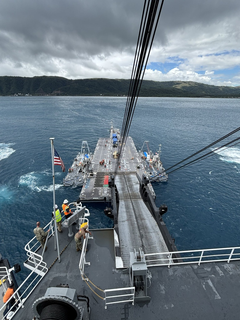 U.S. Marines from 3rd Marine Division work with a technical advisory and assistance team from Blount Island Command during an in-stream offload from the USNS Sisler, a cargo ship operated by Military Sealift Command, April 3 at Dingalan Bay in the Philippines. Equipment, sent from Marine Corps Support Facility Blount Island in Jacksonville, Florida, the hub of Marine Corps’ prepositioning programs, will support Marines participating in Exercise Balikatan 25, which kicks off April 21. Balikatan is a longstanding annual exercise between the Philippines and U.S. armed forces. (Official U.S. Marine Corps photo/Col. Luke Watson)