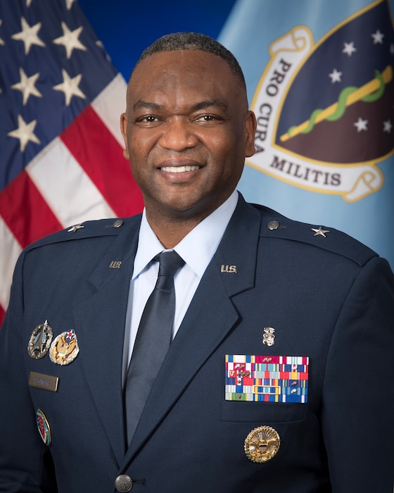 A military members poses for a portrait.