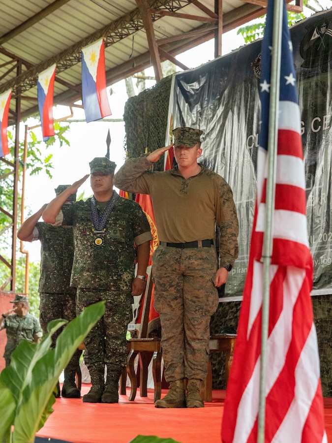 U.S. Marine Corps Capt. Carter J. Collins (right), the company commander of Echo Company, 2nd Battalion, 1st Marine Regiment, Marine Rotational Force – Darwin 25.3 and Maj. Gen. Arturo G. Rojas (left), the commandant of the Philippine Marine Corps salute during the closing ceremony of Marine Exercise 2025 near Cotabato City, Mindanao, Philippines, April 12, 2025. MAREX 2025 is a bilateral exercise between the U.S. Marine Corps and the Philippine Marine Corps designed to further enhance relationships, interoperability, and combined arms capabilities in a realistic training environment. Marine Rotational Force – Darwin 25.3 is part of an annual six-month rotational deployment to enhance interoperability with the Australian Defence Force and Allies and partners and provide a forward-postured crisis response force in the Indo-Pacific. Collins is a native of Arizona. (U.S. Marine Corps photo by Sgt. Ezekieljay Correa)