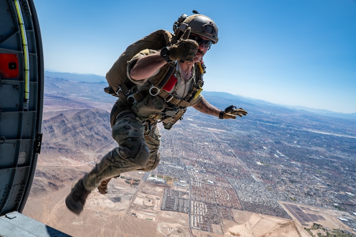 U.S. Air Force Master Sgt. Trevor Clark, an 88th Test and Evaluation Squadron pararescueman jumps from an HH-60W Jolly Green II for Combat Arms Demonstration (CAD) during Aviation Nation Air Show 2025 at Nellis Air Force Base, Nevada, April 5, 2025.
