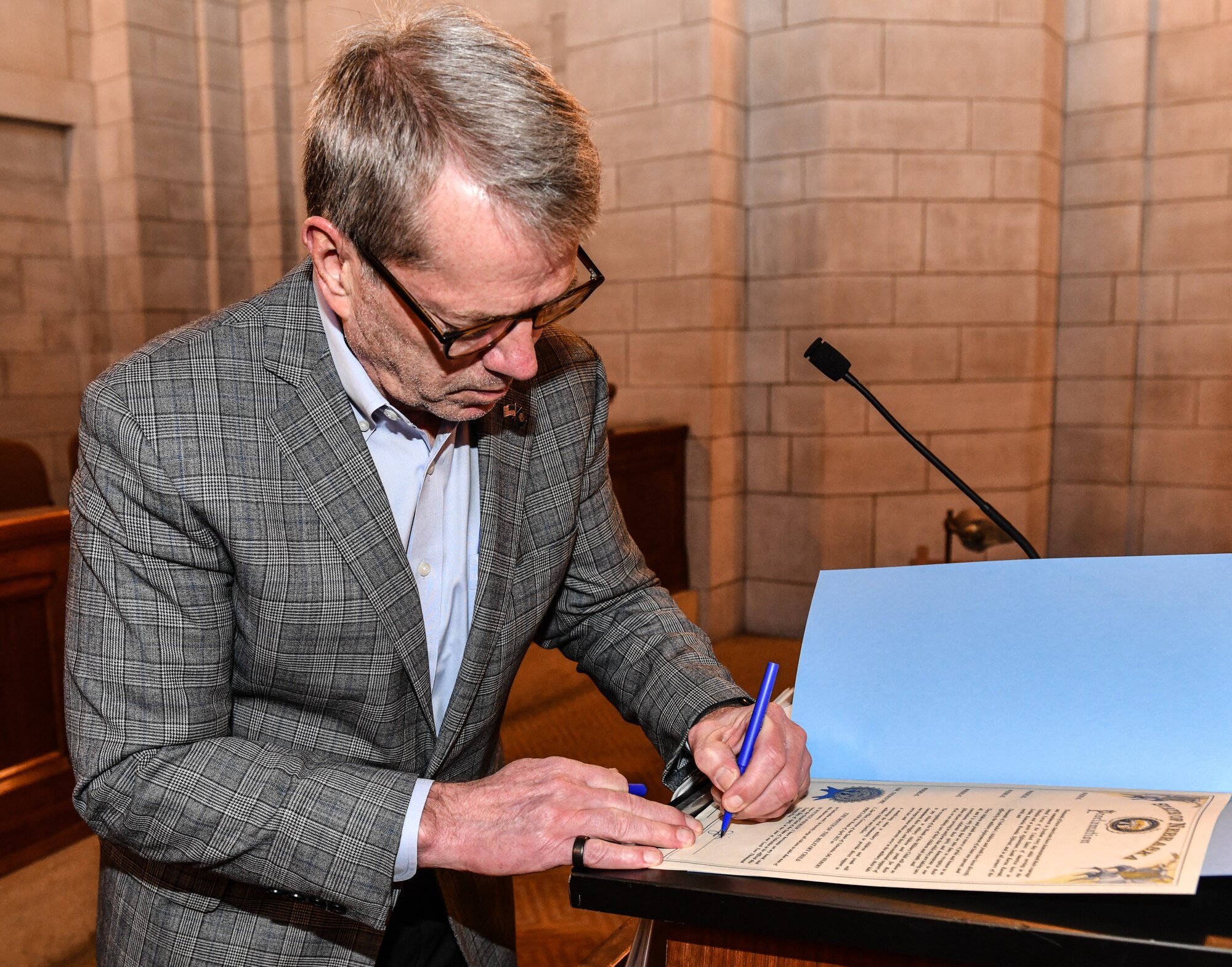 Nebraska governor Jim Pillen signs a proclamation declaring April the Month of the Military Child ini Lincoln, April 10, 2025. Former Secretary of Defense Caspar Weinberger established the tradition in 1986 to highlight the strength of the youngest members of the total force and to honor their sacrifices. (U.S. Air Force photo by Chad Watkins)