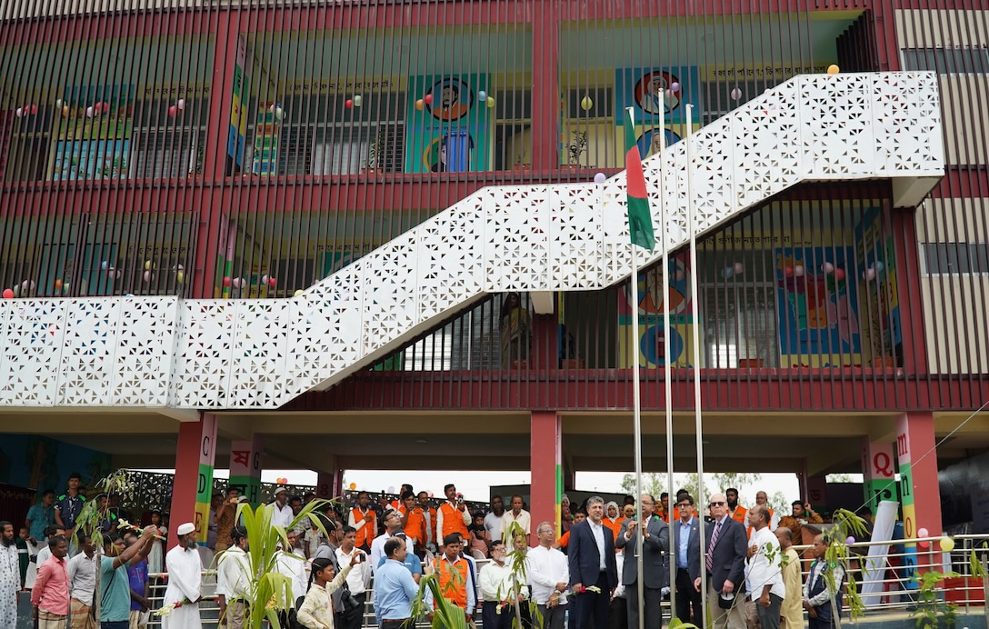 United States and Bangladesh officials celebrated the handover of the Khonjonighona Government Primary School and Multipurpose Disaster Shelter in eastern Bangladesh in October 2024. The school is constructed with the classrooms on the second and third floors to provide a safe area for the community during a flooding emergency.
