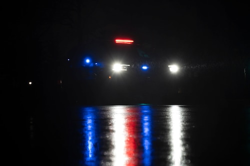 An 87th Security Forces Squadron police car responds to a drone sighting during Operation Honey Badger (OHB) at Joint Base McGuire-Dix-Lakehurst, N.J., April 7, 2025. OHB is an exercise organized by the 87th Civil Engineer Squadron to prepare Airmen for real-world situations and promote mission readiness. (U.S. Air Force photo by Airman 1st Class Luisa E. Dugan)