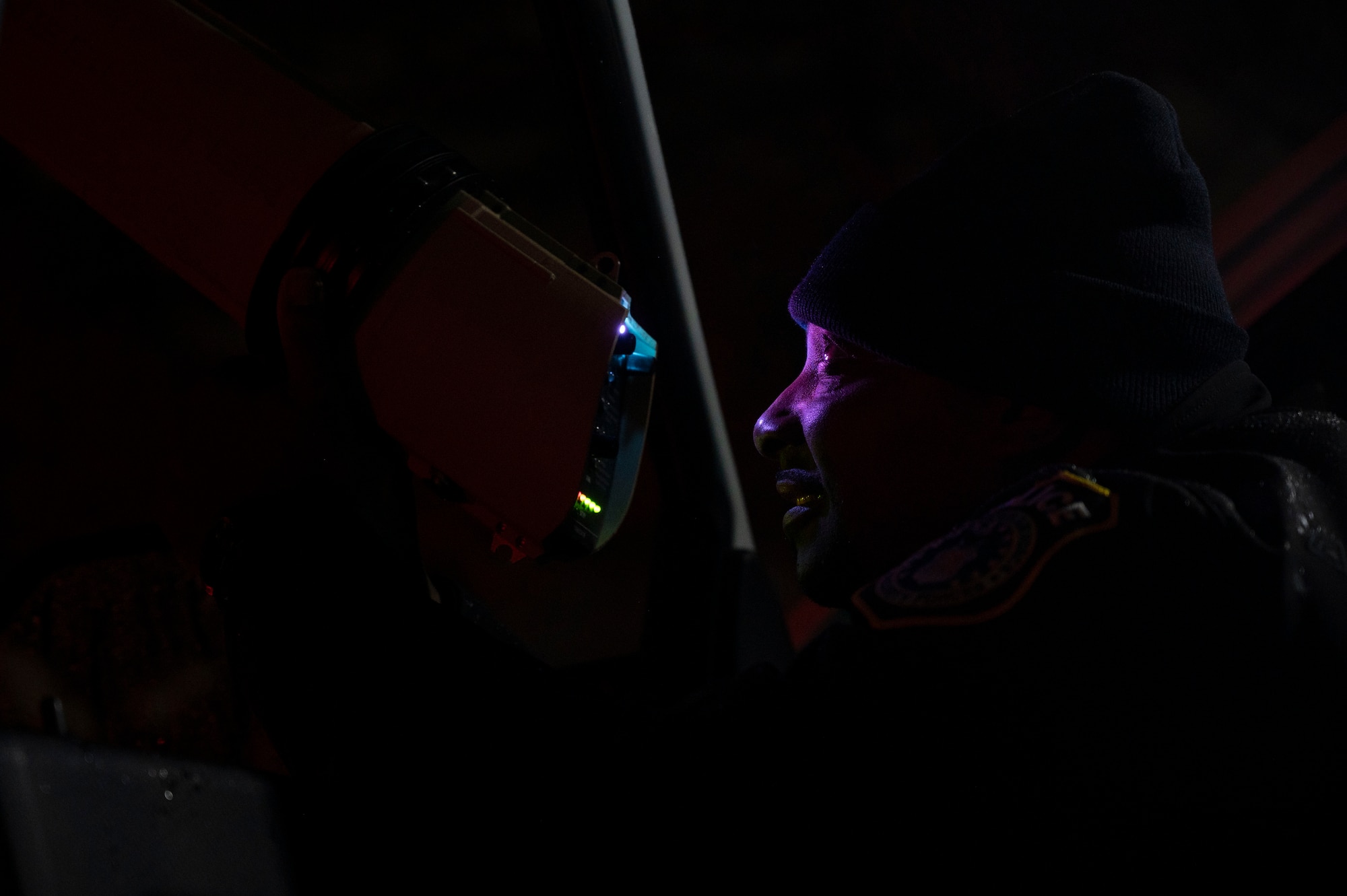 U.S. Air Force officer Damian Johnson, 87th Security Forces Squadron police officer, uses a drone buster to hold a drone in place during Operation Honey Badger (OHB) at Joint Base McGuire-Dix-Lakehurst, N.J., April 7, 2025. OHB is an exercise organized by the 87th Civil Engineer Squadron to prepare Airmen for real-world situations and promote mission readiness. (U.S. Air Force photo by Airman 1st Class Luisa E. Dugan)