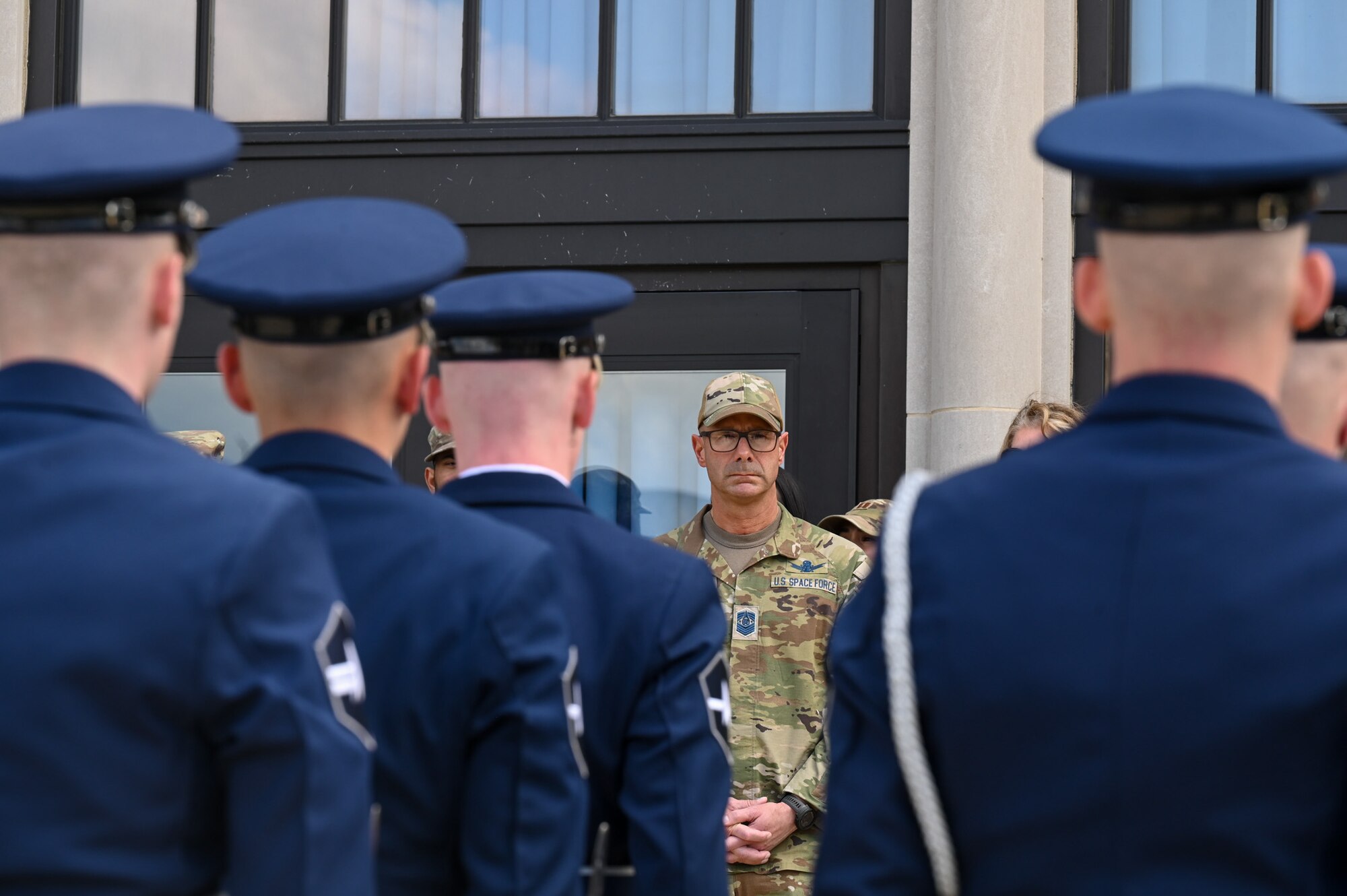 Photo of the Chief Master Sgt. of the Space Force talking to Space Force Honor Guard members.