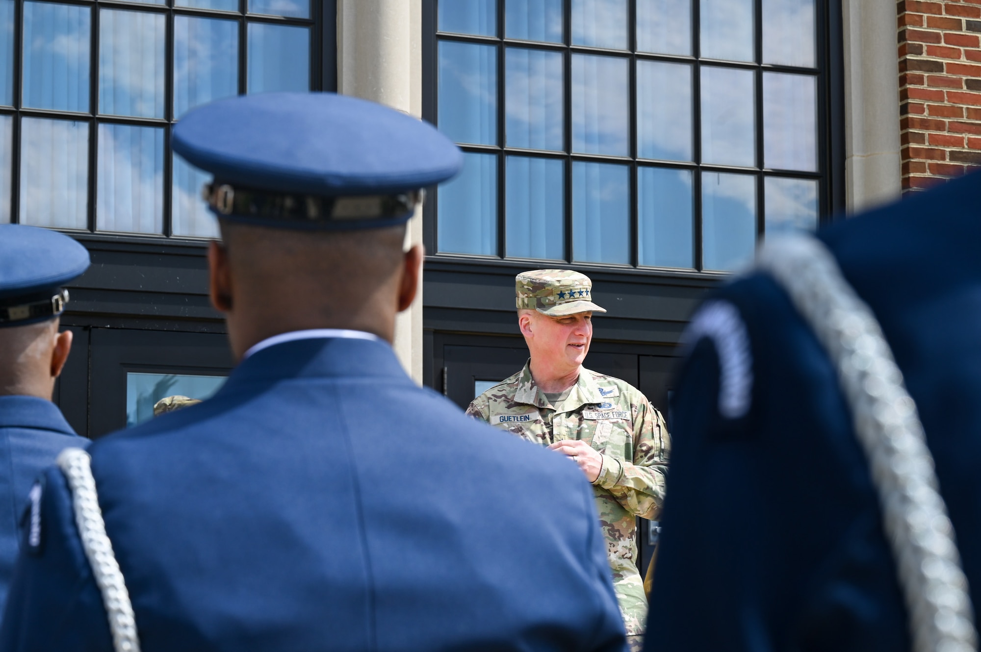 Photo of the Vice Chief of Space Operations talking to Air Force Honor Guard members.