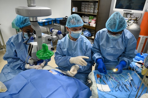U.S. Air Force Maj. Samuel Hobbs, 59th Medical Wing vitreoretinal surgeon, works with local healthcare professionals during ophthalmology surgery at the Georgetown Public Hospital, Georgetown, Guyana, April 7, 2025 during the Lesser Antilles Medical Assistance Team 2025 mission.