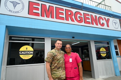 U.S. Air Force Tech. Sgt. Rodrigo Salinas, 433rd Aeromedical Staging Squadron medical technician, and Gangapattie Dani, Georgetown Public Hospital Accident and Emergency Department ward manager, pose for a photos outside the emergency room at the Georgetown Public Hospital during the Lesser Antilles Medical Assistance Team mission in Georgetown, Guyana, April 7, 2025.