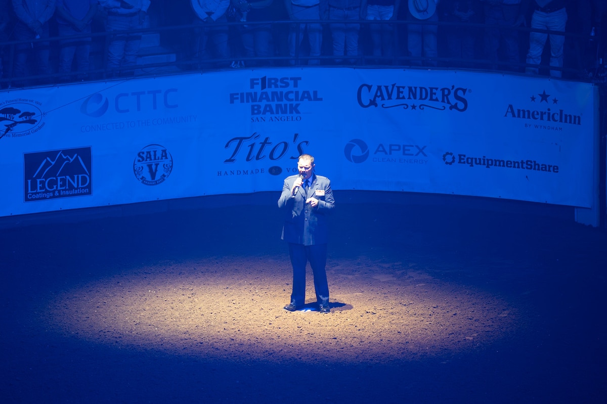 U.S. Air Force Capt. Robert Joiner, 17th Training Wing chaplain, gives the invocation during the San Angelo Stock Show & Rodeo at the Foster Communications Coliseum, San Angelo, Texas, April 16, 2025. During Military Appreciation Night, volunteers from Goodfellow helped lead the opening ceremony. (U.S. Air Force photo by Airman 1st Class Brian Lummus)