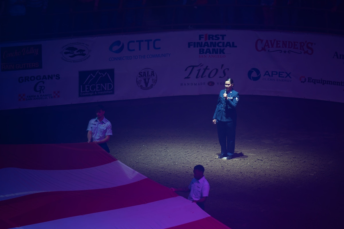 U.S. Air Force Staff Sgt. Jennifer Lopez, 17th Medical Group, sings the National Anthem during the San Angelo Stock Show & Rodeo at the Foster Communications Coliseum, San Angelo, Texas, April 16, 2025. Goodfellow partnered with The San Angelo Stock Show & Rodeo Association to support the opening ceremony of Military Appreciation Night. (U.S. Air Force photo by Airman 1st Class Brian Lummus)