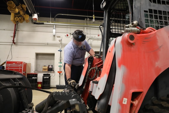A 113th Wing Civil Engineer Squadron member secures protective equipment before handling hazardous equipment at Joint Base Andrews, Md., March 25,2025. The squadron has achieved over 1,114 accident-free days through strict adherence to safety protocols.