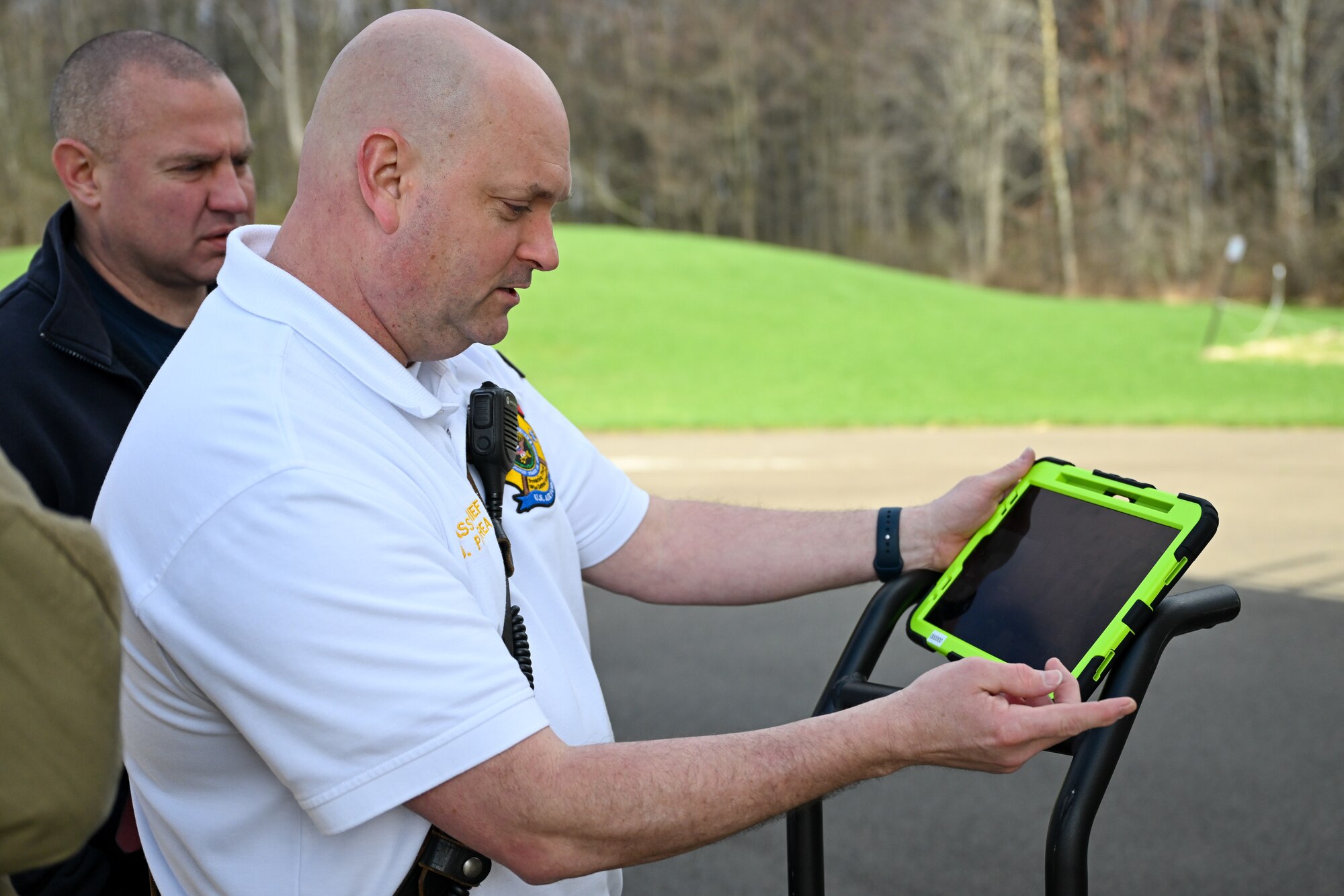 Jeff Pandrea, assistant fire chief, demonstrates the live video feed on a command tablet as part of an augmented reality helmet attachment system for firefighters at YARS, Ohio, April 7, 2025.
