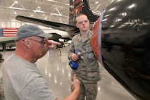 (From left) Darrell Gronau, aviation maintenance instructor, teaches proper riveting techniques to Cash Bowerbank, an ROTC Utah Military Academy student, on display aircraft fuselage skin March 11, 2025, at Hill Air Force Base, Utah. Local students learn, train and develop real-world airframe work skills by participating in local academic partnerships with the Hill Aerospace Museum’s established curriculum at the aircraft restoration facility. (U.S. Air Force photo by Todd Cromar)