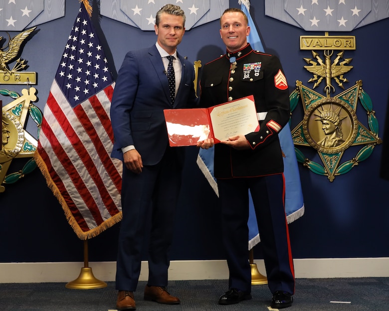 U.S. Marine Corps Sgt. Dakota Meyer, a Medal of Honor recipient, stands with Pete Hegseth, the Secretary of Defense,  after reenlisting in a ceremony at the Pentagon, April 17, 2025. Sgt. Meyer is the only living Medal of Honor recipient currently serving in the Marine Corps. (U.S. Marine Corps photos by Lance Cpl. Abigail Hutcheson)